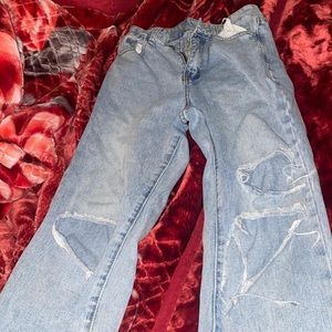 Blue jeans that are baggy and tight around the waist